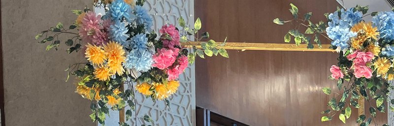Gold frame crossbar with hydrangea and chrysanthemum floral clusters, engagement decoration in Jaipur by Shava Moments