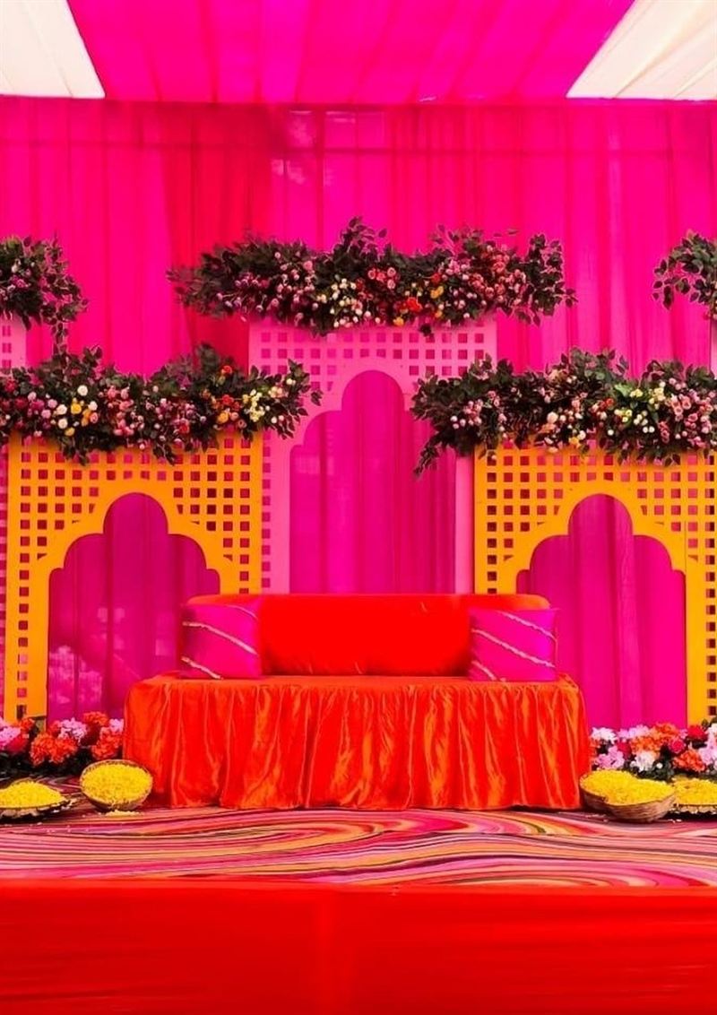 Marigold and jaali haldi stage on a banquet lawn in Jaipur by Shava Moments