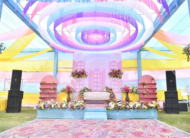 Pastel draped sangeet stage on a lawn in Jaipur by Shava Moments